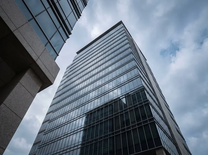 Glass office tower seen from below